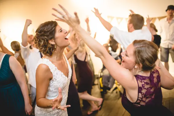 Wedding reception dance with bride and guests at Washington celebration. Lovely Events.