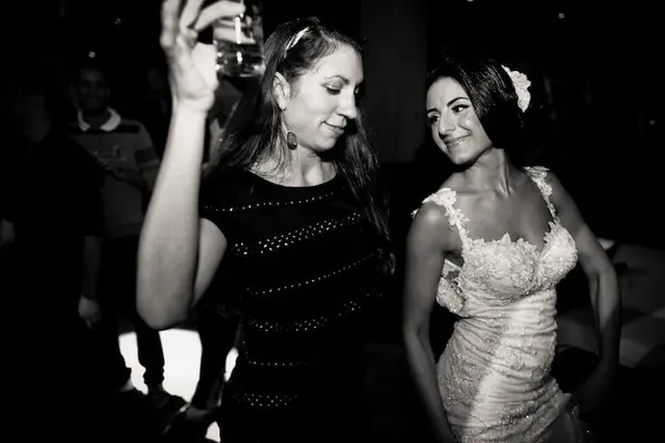 Bride and guest dancing at Washington wedding reception. Lovely Events.