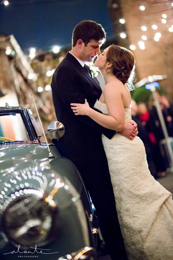 Bride and groom by vintage car at evening Washington wedding. Lovely Events.