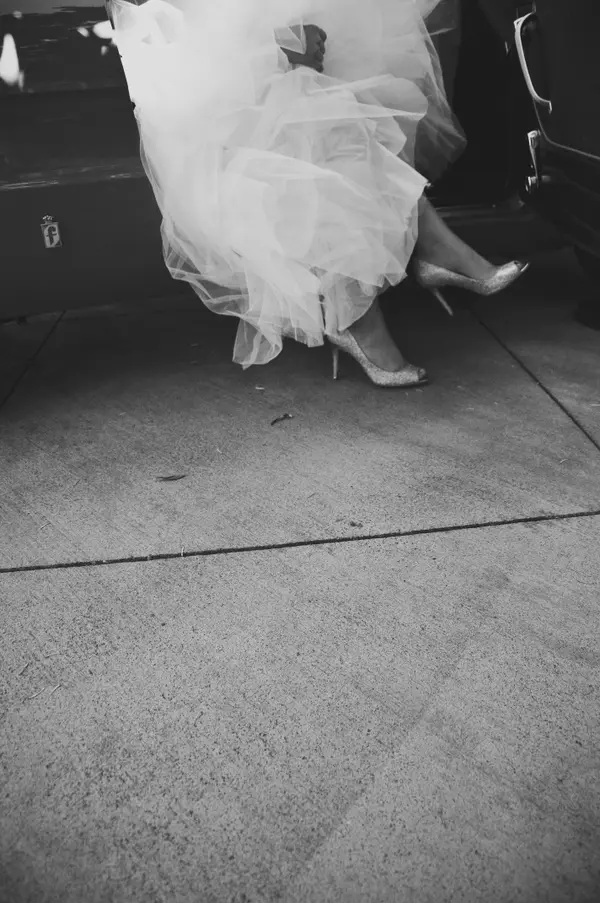 Bride stepping out of car at Pacific Northwest wedding. Lovely Events.