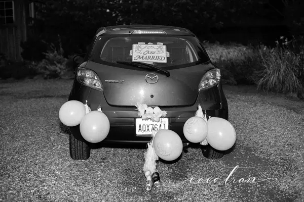Just married wedding send-off car with balloons and flowers at Pacific Northwest wedding. Lovely Events.