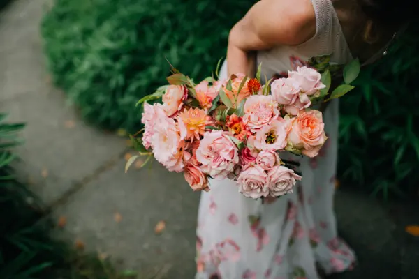 Bridal bouquet with roses and dahlias at outdoor Pacific Northwest wedding. Lovely Events.
