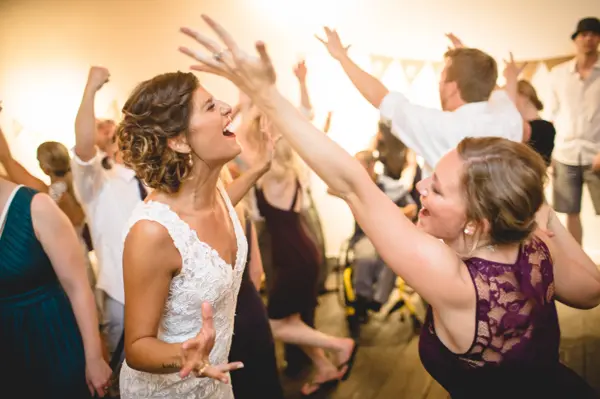 Wedding reception dance with bride and guests at Washington celebration. Lovely Events.